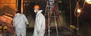 Water Damage Cleanup Techs Cleaning Up Flooded Home