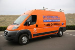 911-restoration-water-damage-mold-remediation-fire-damage-person-van-side-angle